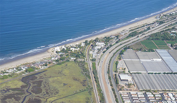 Aerial view of the ocean and highway 101